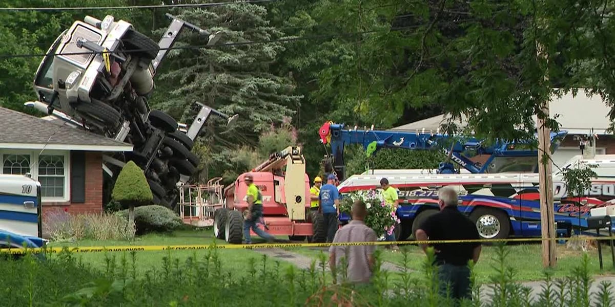 RAW: Tree removal crane crashes onto, damages couple’s home (no audio) [Video]