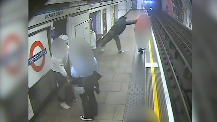 Moment homeless man pushes postman onto Tube tracks caught on CCTV | News [Video]