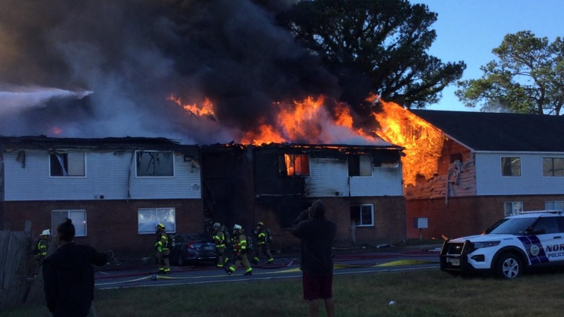 Norfolk firefighters rescue man from large apartment fire, roads closed [Video]